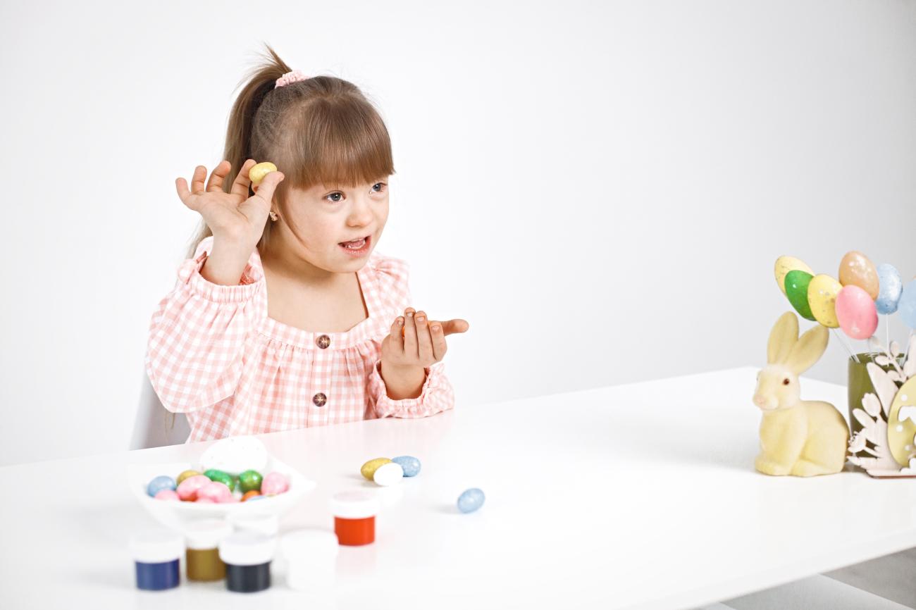 A beautiful girl with down syndrome playing